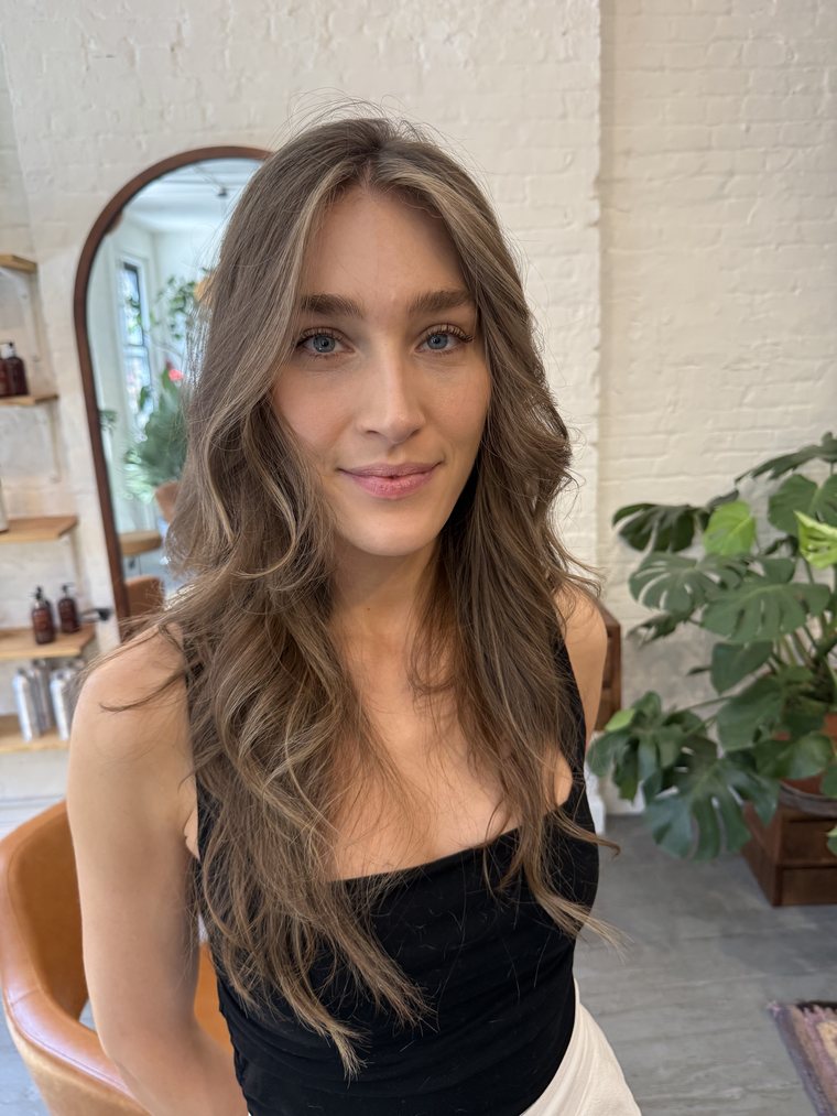 A long, wavy blowout finished for a client on location